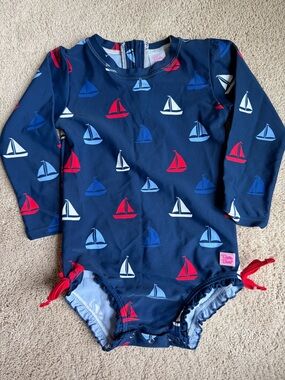 Ruffle Butts Navy Sailboat One-Piece Swimsuit with Red, White & Blue Boats